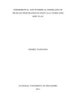 Experimental and numerical modelling of spudcan penetration in stiff clay overlying soft clay 