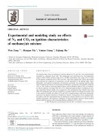 Experimental and modeling study on effects of N2 and CO2 on ignition characteristics of methane/air mixture